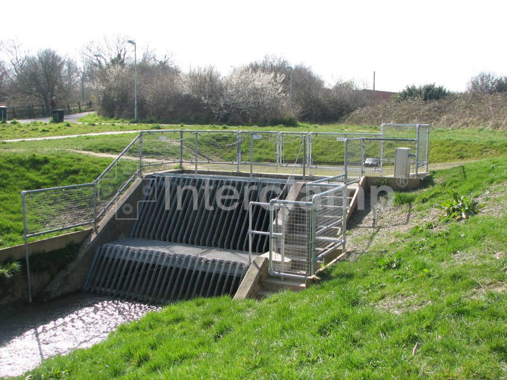 Tube clamp handrail surrounding river culvert